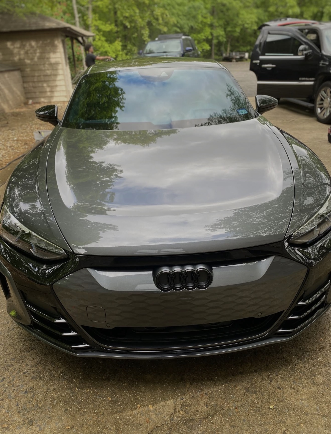 Freshly detailed Audi e-tron GT — gleaming front end with mirror-finish hood