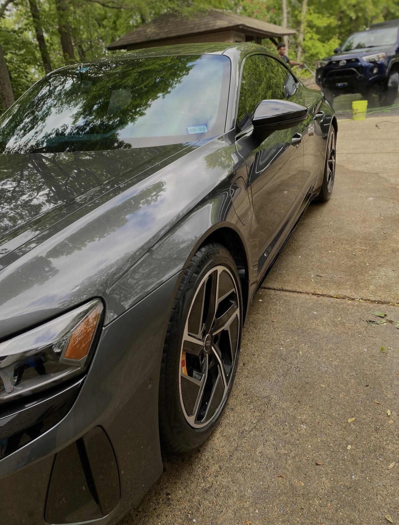 Detailed Audi e-tron GT side profile showing flawless paint reflections